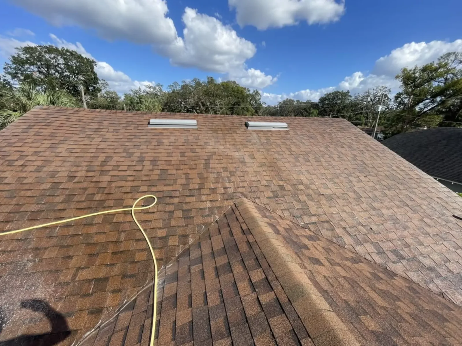 Applying spray-on coating to metal roof