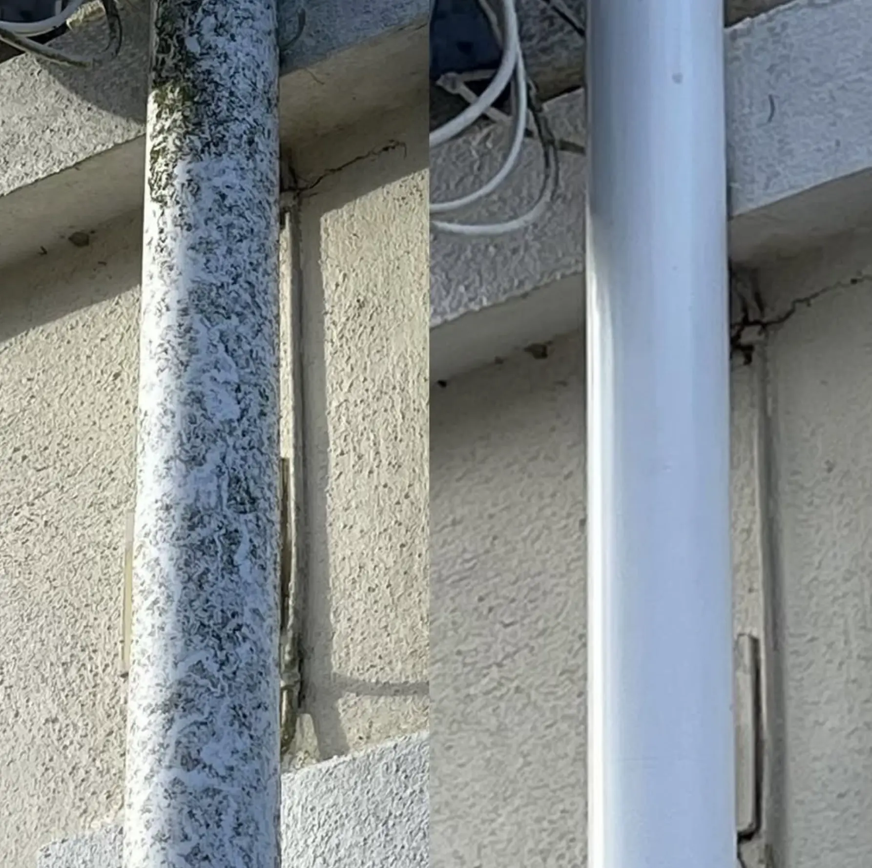 Cleaning fascia board under guttering