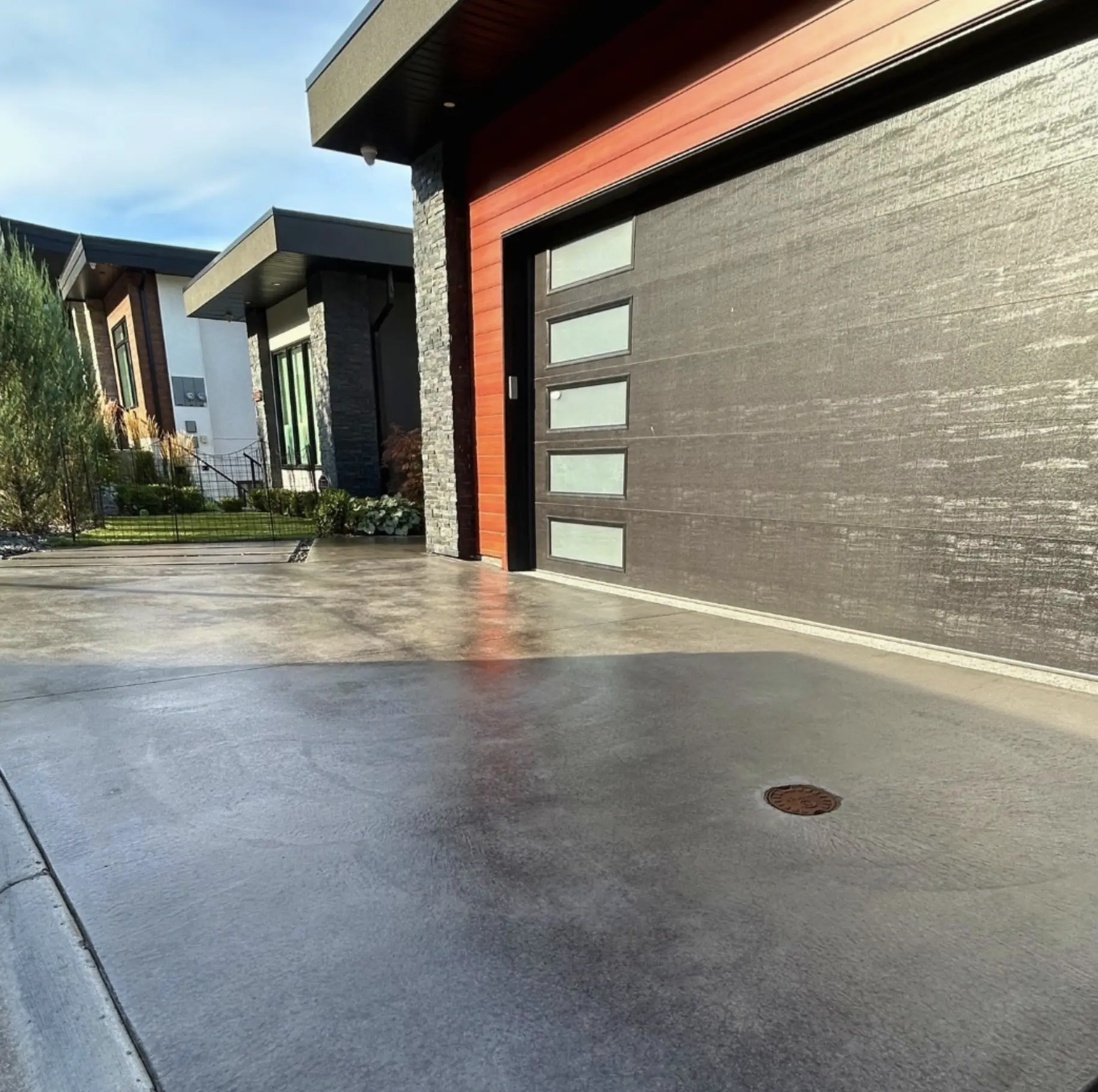 Visible cracks on unsealed concrete driveway
