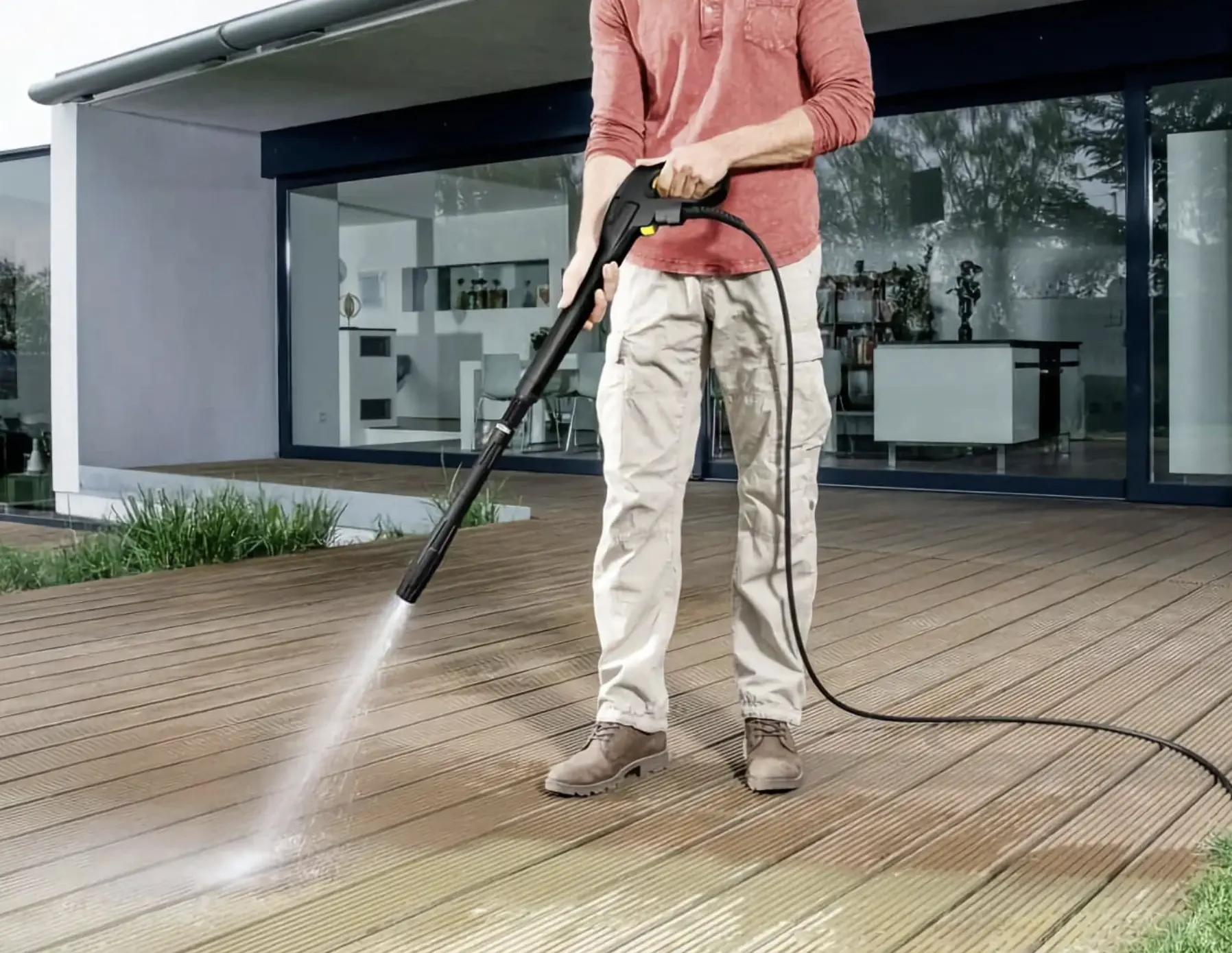 petrol-powered pressure washer cleaning concrete